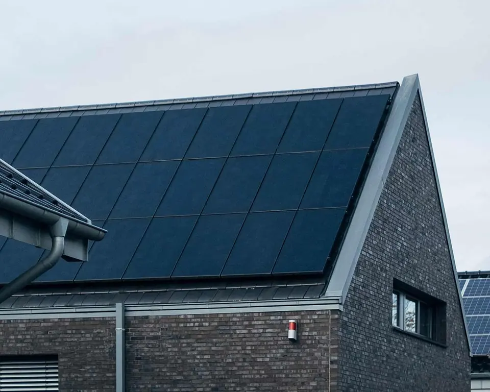 A house with solar panels fitted across the roof