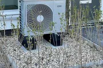 An air source heat pump outside a house